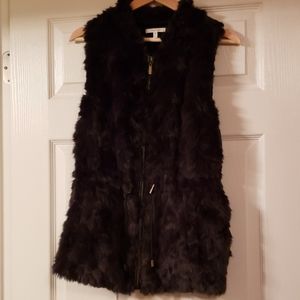 Black fur vest.